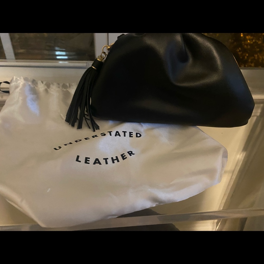 Understated leather Crescent clutch perfect holiday clutch